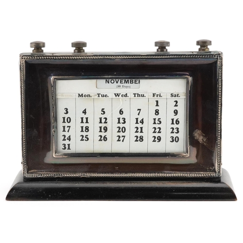 415 - W J Myatt & Co, a George V silver mounted ebonised perpetual desk calendar, Birmingham 1935, 21.5cm ... 