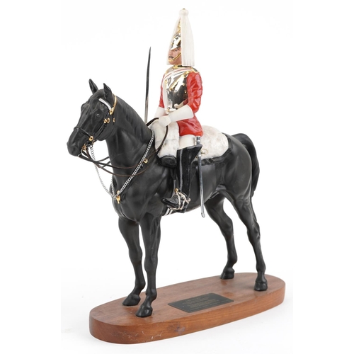 1216 - A Beswick Connoisseur Collection military interest figure - Lifeguard, raised on a wooden plinth bas... 