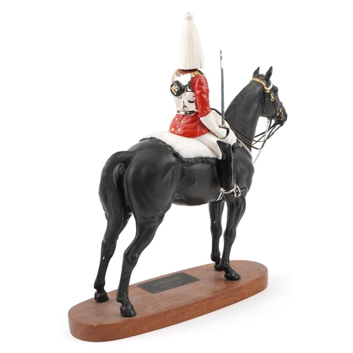 1216 - A Beswick Connoisseur Collection military interest figure - Lifeguard, raised on a wooden plinth bas... 