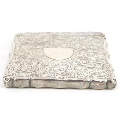 433 - Hilliard & Thomason, a Victorian silver card case engraved with flowers, foliage with blank cartouch... 