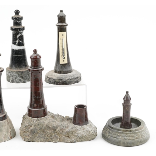 313 - Seven carved Cornish serpentine marble lighthouses including two barometers, the largest 22cm high