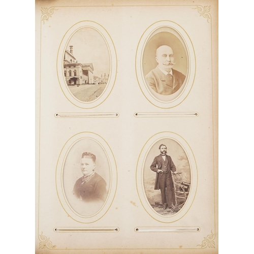 2322 - Victorian leather cabinet card album with black and white cabinet cards.