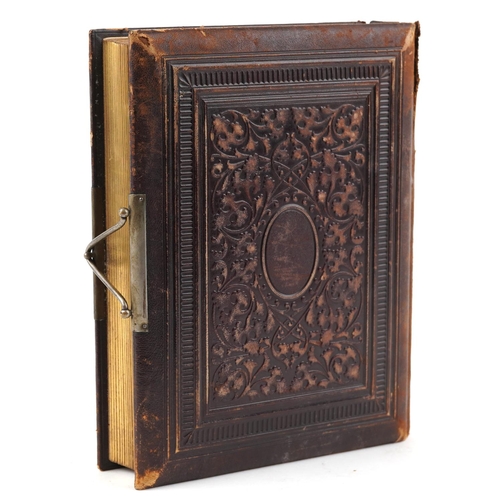 2322 - Victorian leather cabinet card album with black and white cabinet cards.