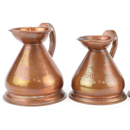 130 - A graduated set of five late 19th century copper measuring jugs, largest H-13cm