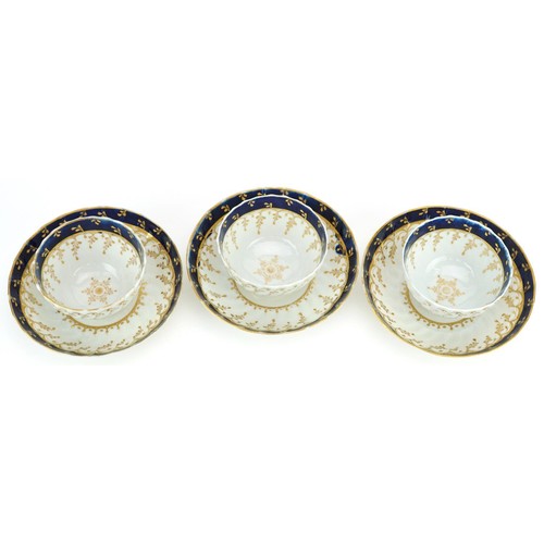 206 - A set of three early 19th century John Rose Coalport hand painted porcelain cups and saucers with gi... 