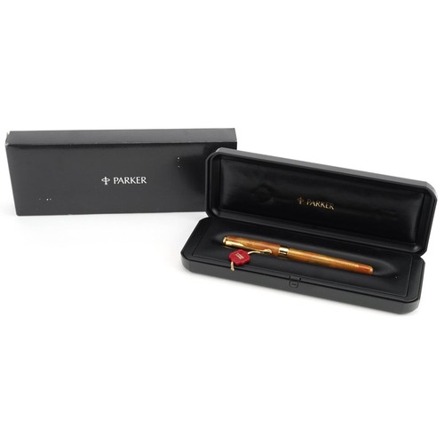 82 - A Parker Sonnet Ambre ballpoint pen, France, with case and box.