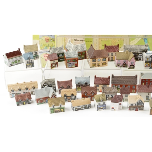 1234 - A collection of Wade porcelain houses including Whimsey-on-Why and Whimsey in the Vale together with... 