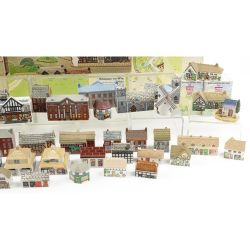 1234 - A collection of Wade porcelain houses including Whimsey-on-Why and Whimsey in the Vale together with... 