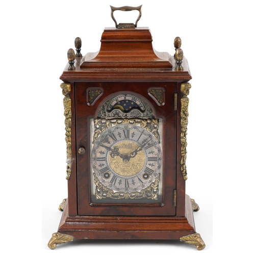 160 - A late 20th century Warmink 'Wuba' walnut mantel clock with Moonphase, the silvered dial with black ... 