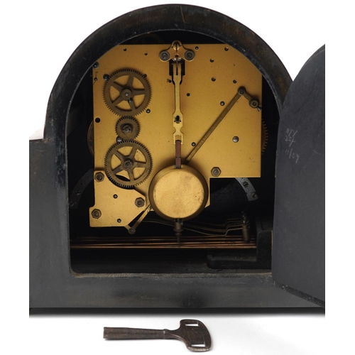 1339 - An Art Deco walnut mantle clock with eight day movement, the circular dial with black roman numerals... 