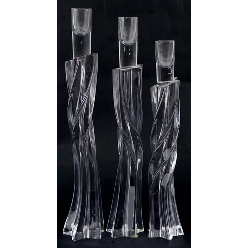 328 - Three Roger Tye contemporary art glass candlesticks the largest 37.5cm high.