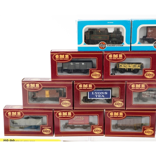 1313 - A collection of Airfix railway coaches, buildings and a locomotives with fitted boxes, including Min... 