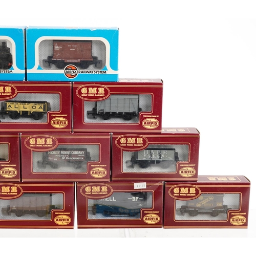 1313 - A collection of Airfix railway coaches, buildings and a locomotives with fitted boxes, including Min... 