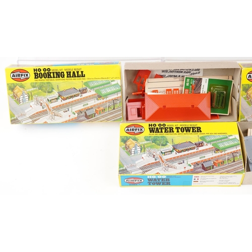 1313 - A collection of Airfix railway coaches, buildings and a locomotives with fitted boxes, including Min... 