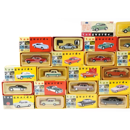 1309 - A collection of Vanguard die-cast vehicles with boxes including VW Beetle Split Screen, Ford Cortina... 