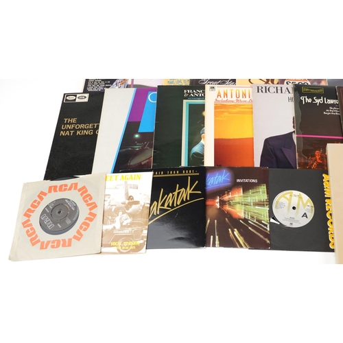 2025 - A collection of vinyl LP records to include Neil Diamond, Barry Manilow, Johnnie Mathis, The Carpent... 