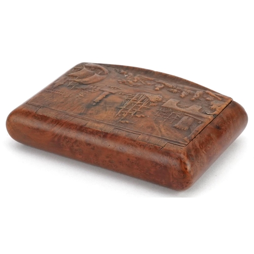 85 - An 18th century carved burr walnut rectangular snuff box, the hinged lid carved in relief with a har... 