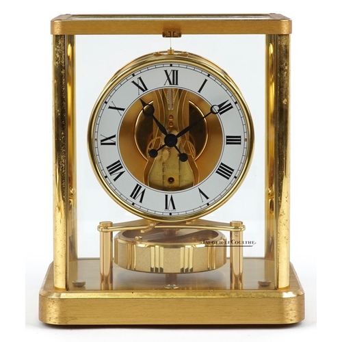 61 - A Jaeger-LeCoultre four glass Atmos clock, the circular enamelled dial with black Roman numerals, th... 