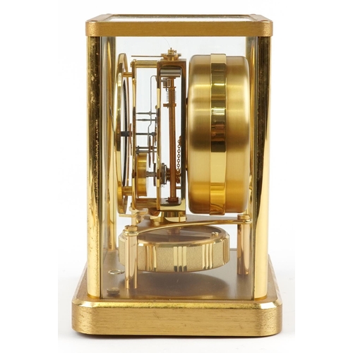 61 - A Jaeger-LeCoultre four glass Atmos clock, the circular enamelled dial with black Roman numerals, th... 