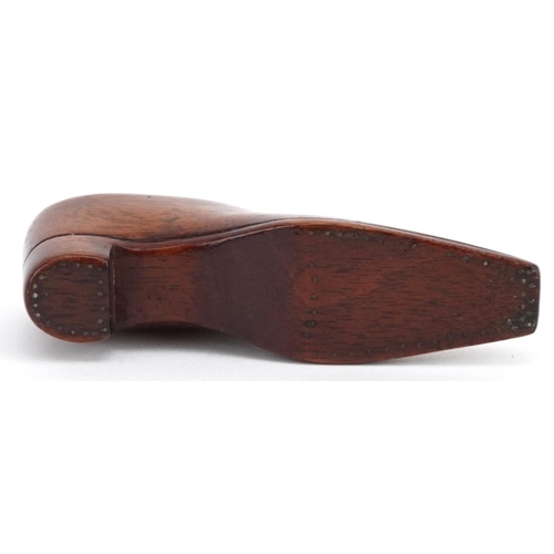 310 - A late 19th century treen forget-me-not carved model of a gentlemen's shoe, 11cm in length.