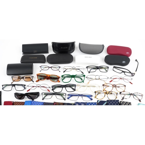 543 - A collection of vintage and later gentlemen's ties, spectacles, sunglasses and glasses cases.