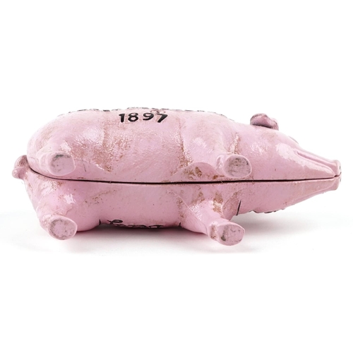 1432 - A cast iron pink 'piggy' bank, 19cm in length.