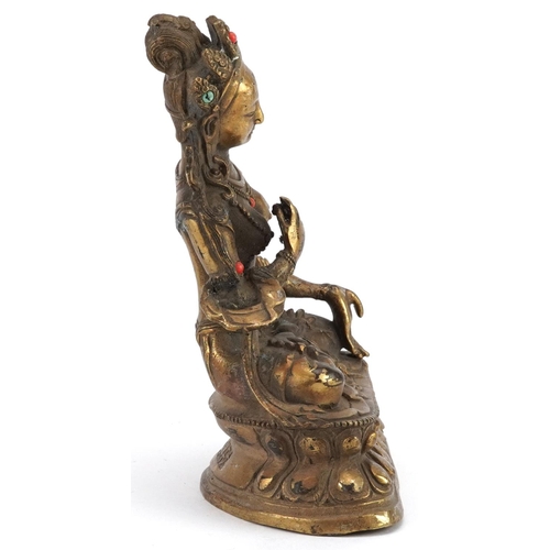 252 - A Chino Tibetan patinated bronze figure of a seated Buddha with turquoise and coral coloured cabocho... 