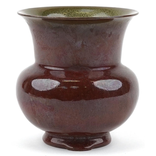 249 - A Chinese sang de boeuf style pottery vase, 15.5cm high.