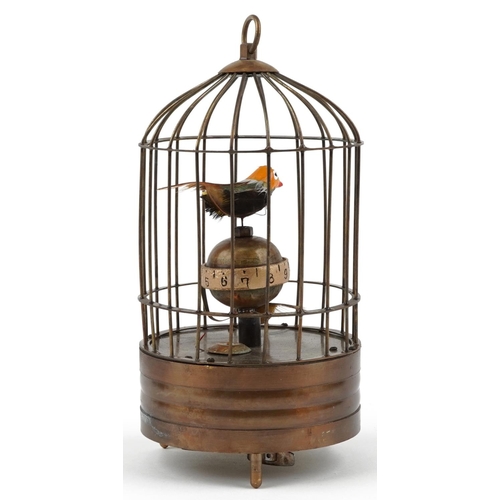 1381 - A clockwork automaton bird cage alarm clock, 19cm high.