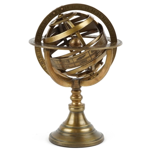 1441 - A brass rotating table compass decorated with zodiac signs, 20cm high.