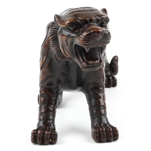 111 - A Japanese brown patinated bronze okimono figure of a tiger, 34cm in length.