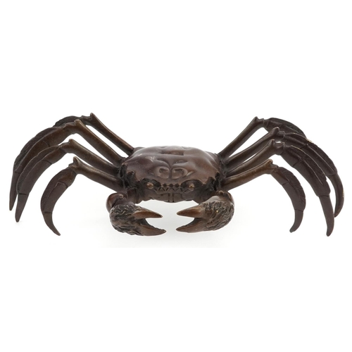 114 - A Japanese patinated bronze okimono figure of a crab, character marks to the base, 24cm wide.