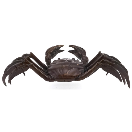 114 - A Japanese patinated bronze okimono figure of a crab, character marks to the base, 24cm wide.