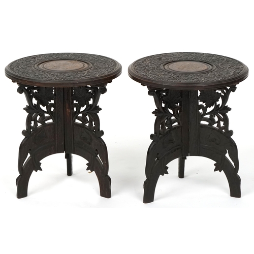 1036 - A pair of early 20th century Anglo Indian carved hardwood folding occasional tables, 33cm high x 29c... 