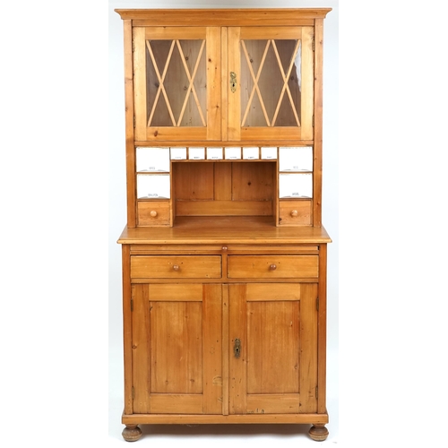 1134 - A 20th century pine narrow dresser, the top fitted with ceramic pull out drawers above two drawers a... 