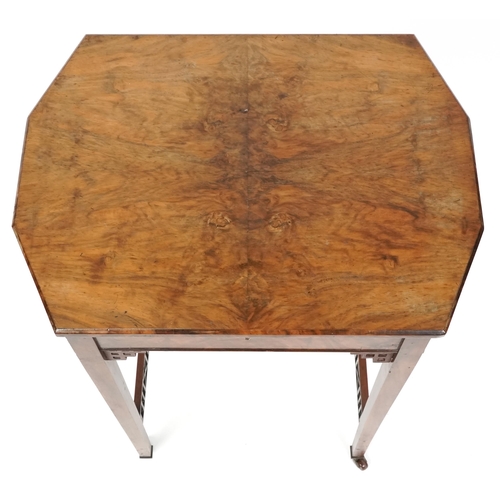 1045 - A mid Victorian burr walnut work table, the hinged lid above a well, raised on square tapering legs,... 