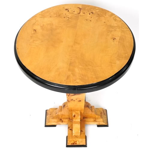 1052 - An Art Deco style satin maple veneered circular lamp table with ebonised decoration, 73cm high x 59c... 