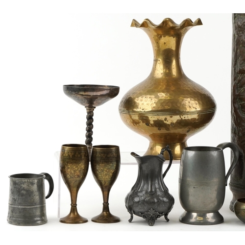 1569 - A small collection of metalwork to include an embossed brass stick stand, three pewter items and eas... 