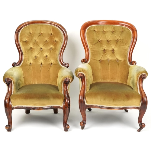 1047 - A near pair of Victorian mahogany framed scroll armchairs upholstered in green velour, 102cm high x ... 