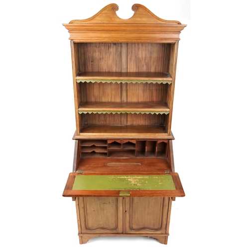 1070 - A 20th century French walnut bureau bookcase, the fall front above two drawers and a cupboard, 174cm... 