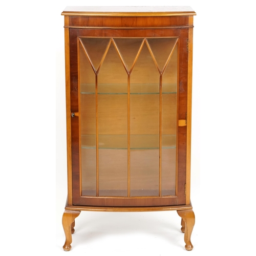 1096 - A late 20th century yew bow front display cabinet, 112cm H x 60cm W x 30cm D.