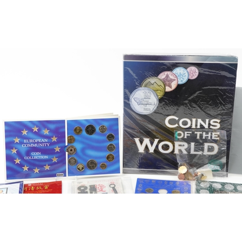 2184 - A quantity of world coins and medals in packs to include two Rugby World Cup 2003 five dollar uncirc... 