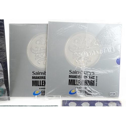 2184 - A quantity of world coins and medals in packs to include two Rugby World Cup 2003 five dollar uncirc... 