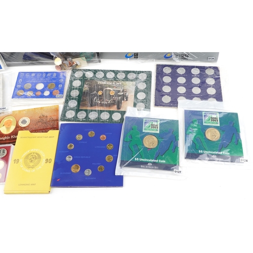 2184 - A quantity of world coins and medals in packs to include two Rugby World Cup 2003 five dollar uncirc... 