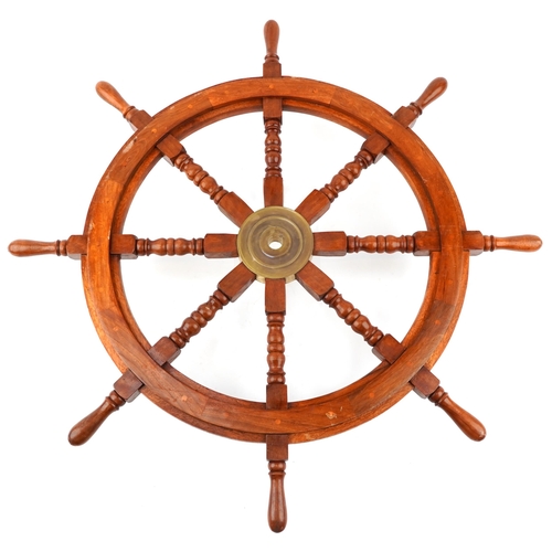 1581 - Of naval interest, a ship's wheel with brass fitting, 91cm in diameter.