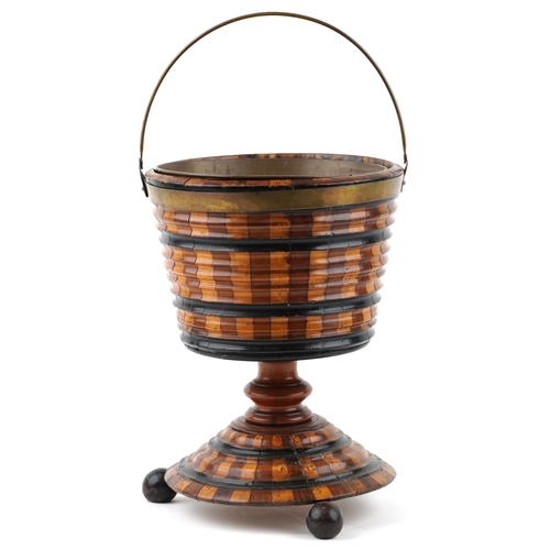 566 - A Victorian style mahogany floor standing ice bucket with brass handle, 41cm high x 31cm in diameter... 