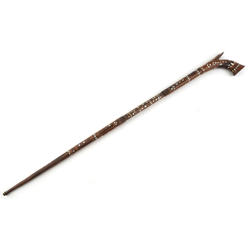 1405 - An Islamic wooden walking stick with mother-of-pearl inlaid decoration, 97cm in length.