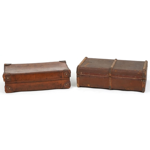 1100 - An early 20th century brown leather suitcase, 67cm wide, together with a similar brown canvas case, ... 