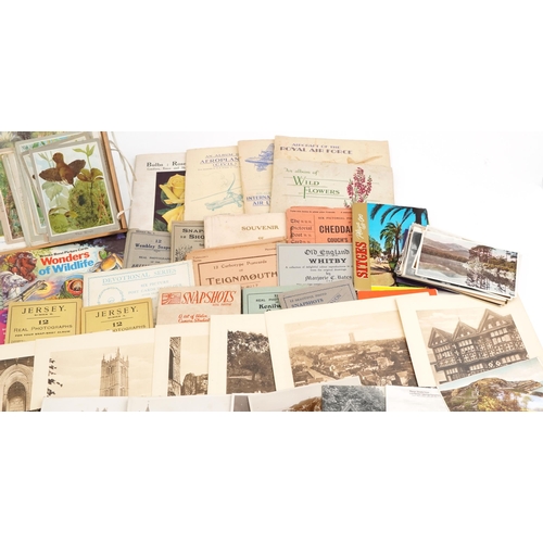 2254 - A mixed group of ephemera to include various cigarette card sets, photographic holiday souvenir phot... 