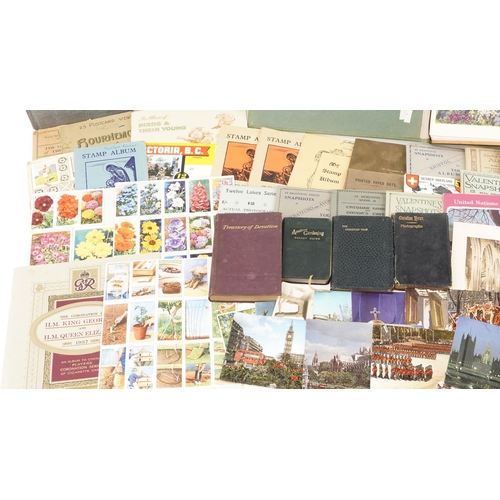 2254 - A mixed group of ephemera to include various cigarette card sets, photographic holiday souvenir phot... 